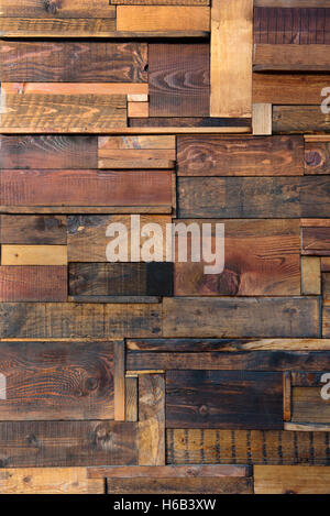 Abstract wooden plank background with randomly arranged short lengths of old weathered wood in a full frame view Stock Photo