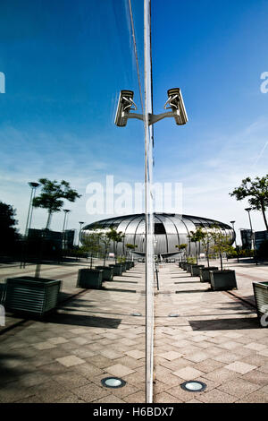 Reflection of surveillance cameras on side of modern glass building Stock Photo