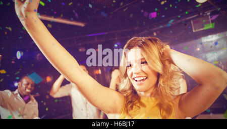 Composite image of happy woman dancing cheerfully Stock Photo