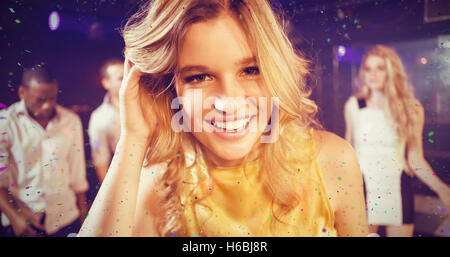 Composite image of portrait of friends dancing cheerfully Stock Photo