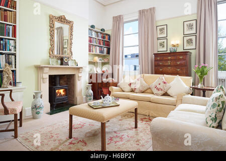 The living room in a period Georgian apartment showing antique furniture & paintings. Gloucestershire, UK Stock Photo