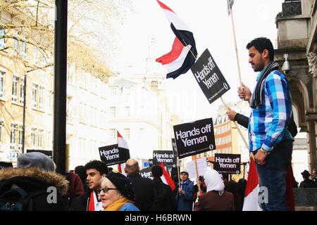 Protesters line up outside of the Saudi Arabian embassy on Charles Street as a demonstration against the western backed war in Yemen that has claimed the lives of tens of thousands of people. Stock Photo