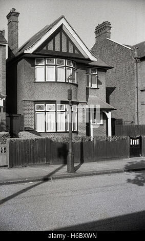 1930s, historical, exterior view of a typical interwar built pebble dash detached house with features such as porch and stained glass windows. Stock Photo
