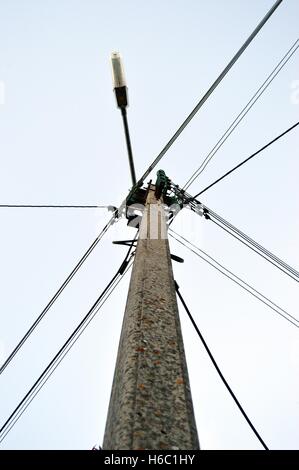Electric pole with cables and street lighting Stock Photo - Alamy