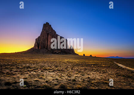 Sunset above Shiprock in New Mexico Stock Photo