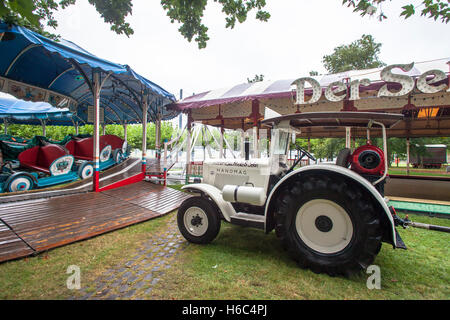 Europe, Germany, Duesseldorf, old Hanomag tractor on a fun fair near the state parliament.