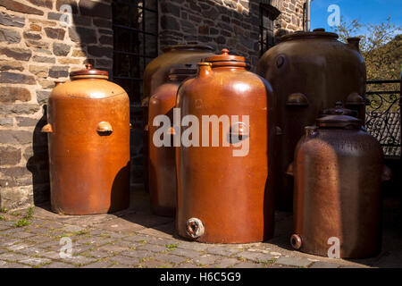 Germany, Hagen, Hagen Open-air Museum, large clay jugs in front of the old vinegar brewery and the mustard mill. Stock Photo