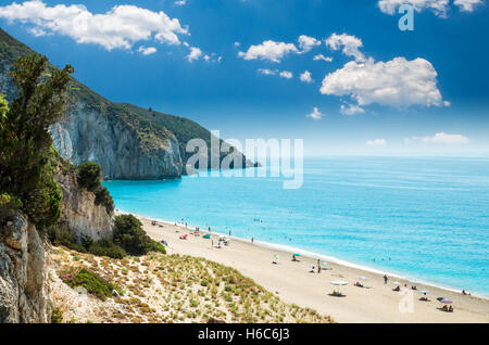 Milos beach on Lefkada island, Greece. The beach is near Agios Nikitas village. People relaxing at the beach. Stock Photo