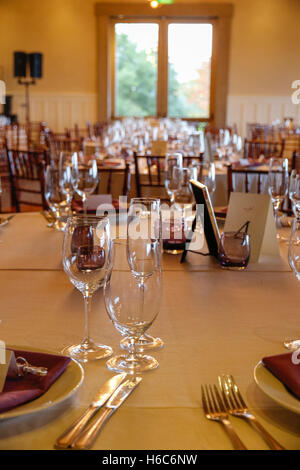 Purple and white themed reception dinner Stock Photo