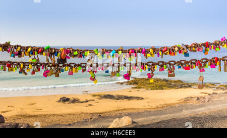 Padlocks of love on rusty chain seaview Stock Photo