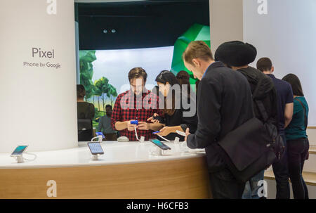 Visitors try out the new Pixel 2 smartphones and the Daydream View ...