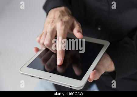 Young businessman holds tablet. Stock Photo