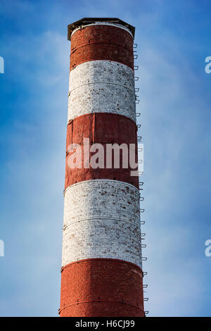 high brick chimney against the sky Stock Photo