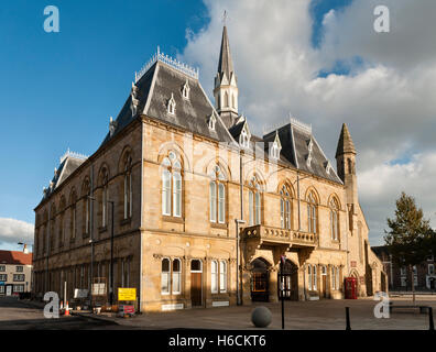 Bishop Auckland, County Durham, UK. The Victorian Gothic town hall in the market place, containing the library and a theatre Stock Photo