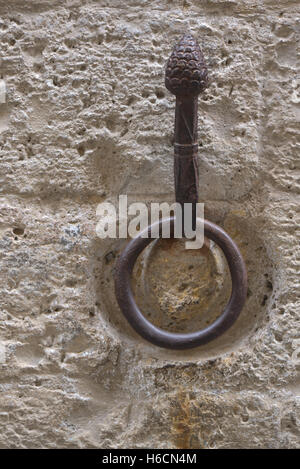 Outdoor old horse hitching ring on a historical wall Stock Photo