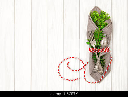 Festive table place setting decoration with christmas tree brunches Stock Photo