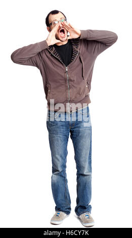 An adult caucasian man in his early 30s wearing casual sneakers, a pair of blue jeans and a hoodie over a black t-shirt. He's lo Stock Photo