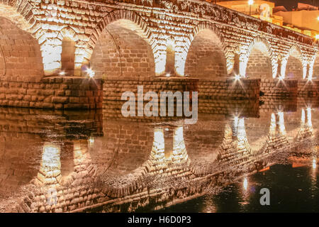 Roman bridge over Guadiana River at night, Merida, Spain Stock Photo