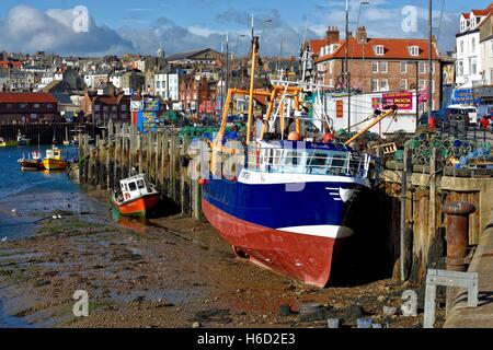 A fishing trawler at low tide in Scarborough Harbour.North Yorkshire,England UK Stock Photo