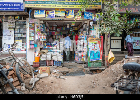 People shopping in an Indian bookshop in a run-down area of Mylapore, Chennai, Tamil Nadu, India Stock Photo