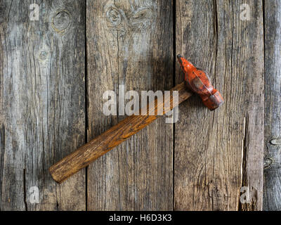 Old rusty hummer on wooden weathering table Stock Photo