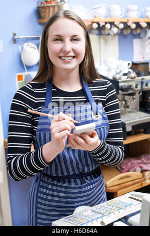 Waitress In Cafe Taking Customer Order Stock Photo