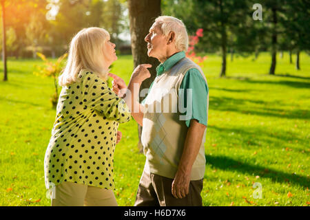 Couple pointing at each other. Stock Photo