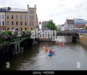 Kayakers are on a sightseeing trip through canals in Gothenburg city, Sweden. Stock Photo