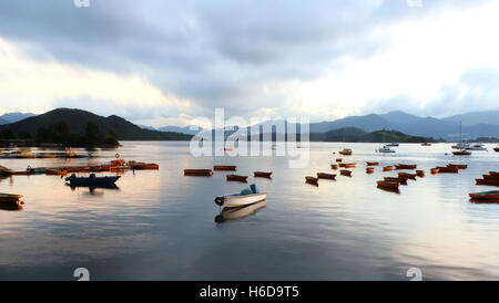 Some fishing and recreational boats on the lake Stock Photo