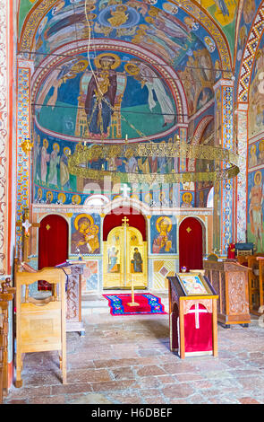 BUDVA, MONTENEGRO - JULY 16, 2014: The interior of the Assumption Church of Podmaine Monastery, decorated by frescos and wooden Stock Photo