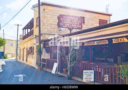 The cozy cafe with the shady summer terrace in the centre of  the village Stock Photo