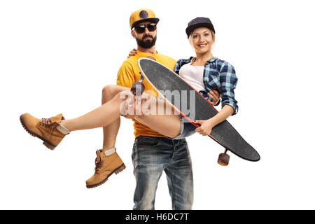 Bearded man carrying a female skater with a longboard in his hands isolated on white background Stock Photo