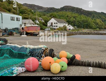 Fishing net and coloured floats on the pier in Gairloch, Wester Ross, Highland, Scotland Stock Photo
