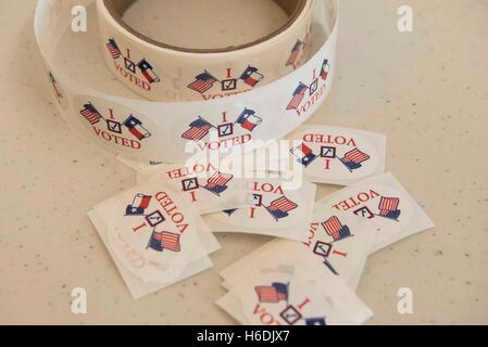 A roll of "I voted" stickers await early voters at a polling station in Karnes City, Texas. Stock Photo