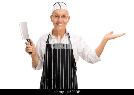 Mature butcher holding a cleaver and gesturing with his hand isolated on white background Stock Photo
