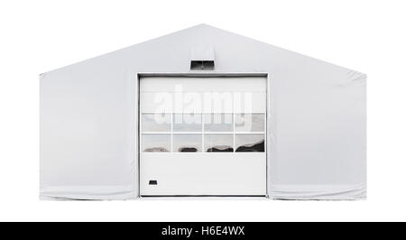 Facade of storage warehouse with closed gate isolated on white background Stock Photo