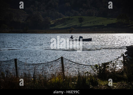 Fly fishing on Watendlath Tarn, Cumbria, UK. Stock Photo