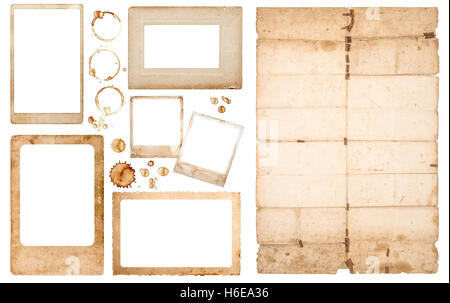 Aged photo frames, used folded paper sheet and coffee stains on white background. Scrapbook elements Stock Photo