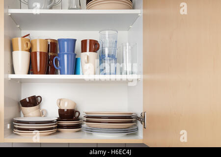 Kitchen cabinet or cupboard for dishes Stock Photo by ©buecax