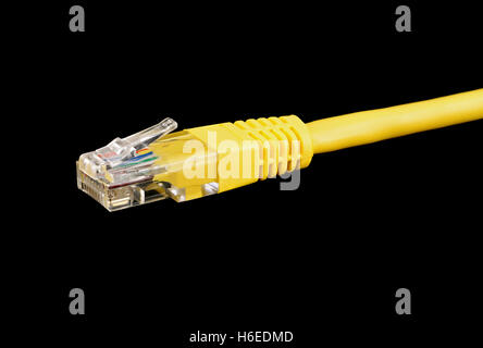 Stacked macro of a cat5 ethernet cable isolated on a black background Stock Photo