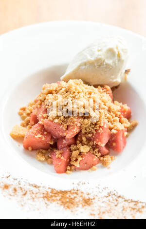 apple crumble with Icecream and cinnamon powder Stock Photo