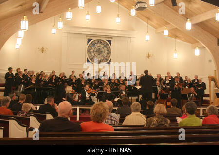 Choir and orchestra having a public performance in church Stock Photo