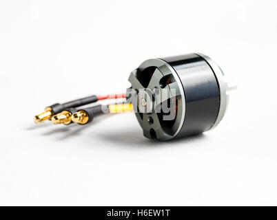 Small electric motor and wires on white Stock Photo