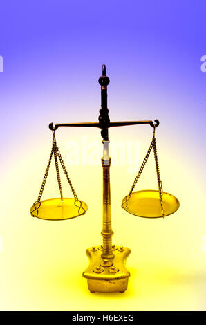 Mechanical golden weight scale, also  laboratory balance, balance scale, or beam balance Stock Photo