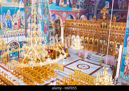 The wooden iconostasis of Soter Christ Resurrection Church with the scenic golden chandelier, Sotira, Cyprus Stock Photo