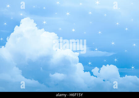Blue cloud floating on blue sky with fake star light surround cloud. Stock Photo