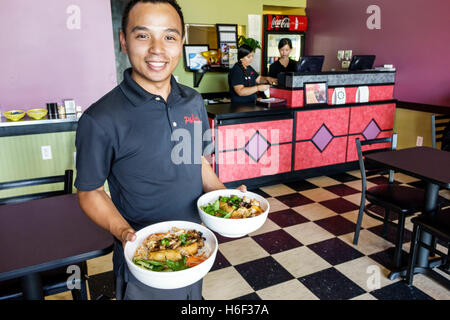 St. Saint Lucie Florida,Pho Deli,restaurant restaurants food dining cafe cafes,Vietnamese,interior inside,Asian adult,adults,man men male,server,manag Stock Photo