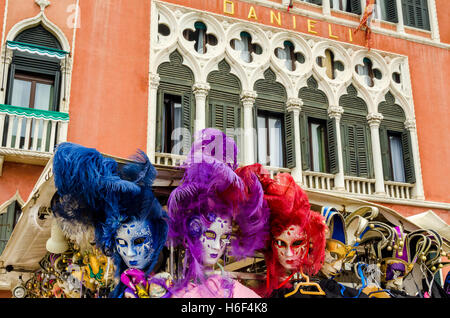 Colourful carnival masks on sale in front of hotel Danieli Stock Photo