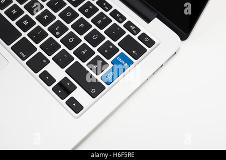 Laptop's keyboard with blue Start up key and copyspace Stock Photo