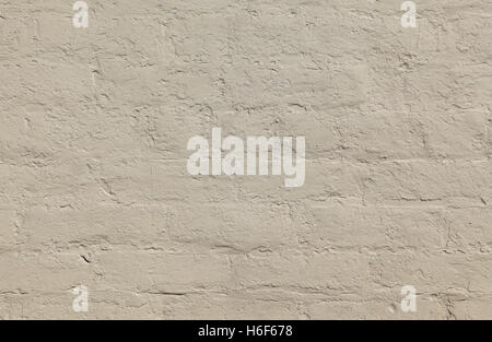 Grey painted brick wall forms a pattern that can be used for backgrounds. Stock Photo